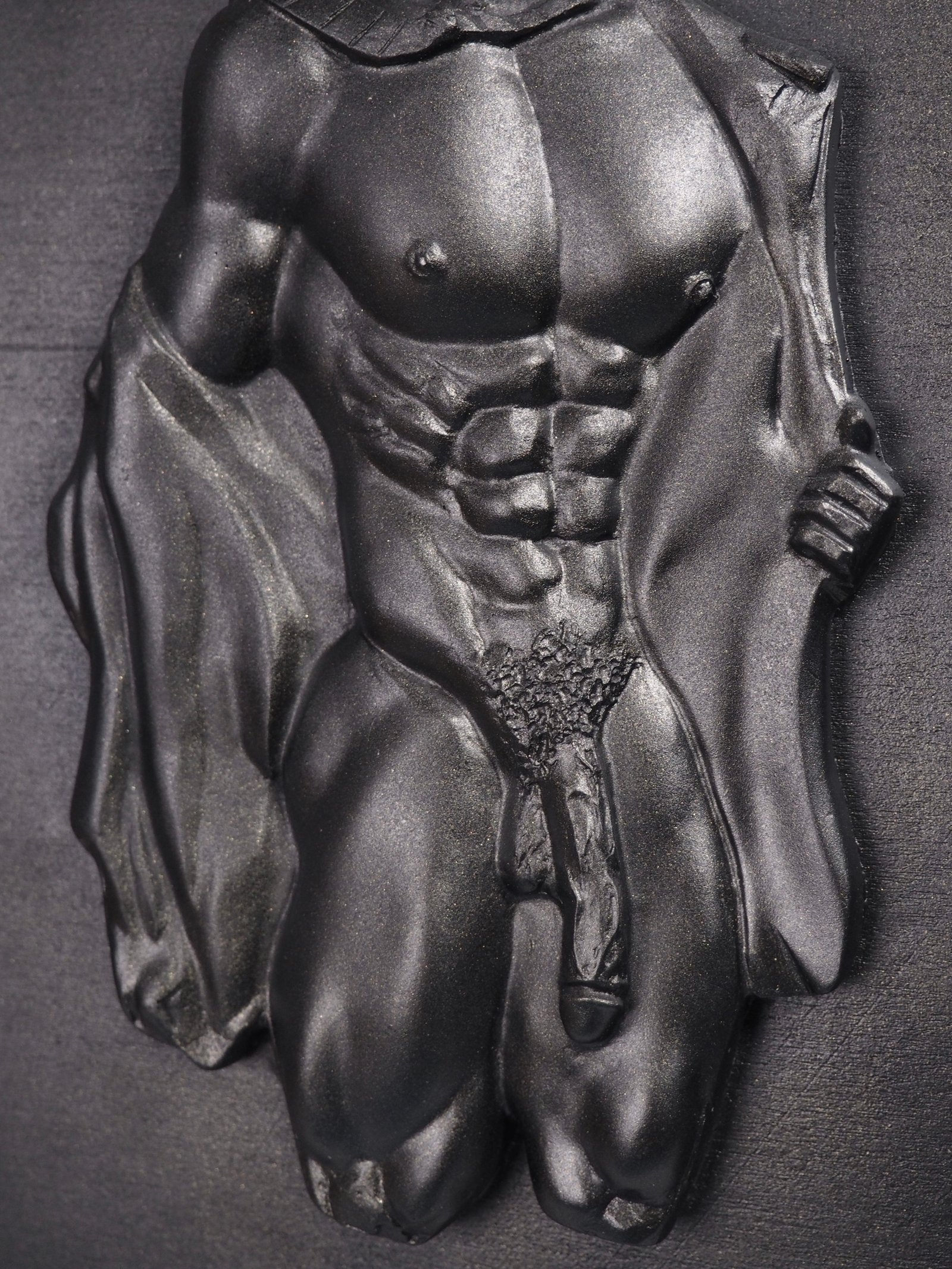 Detail view of Beneath the Rank Black Gold resin sculpture