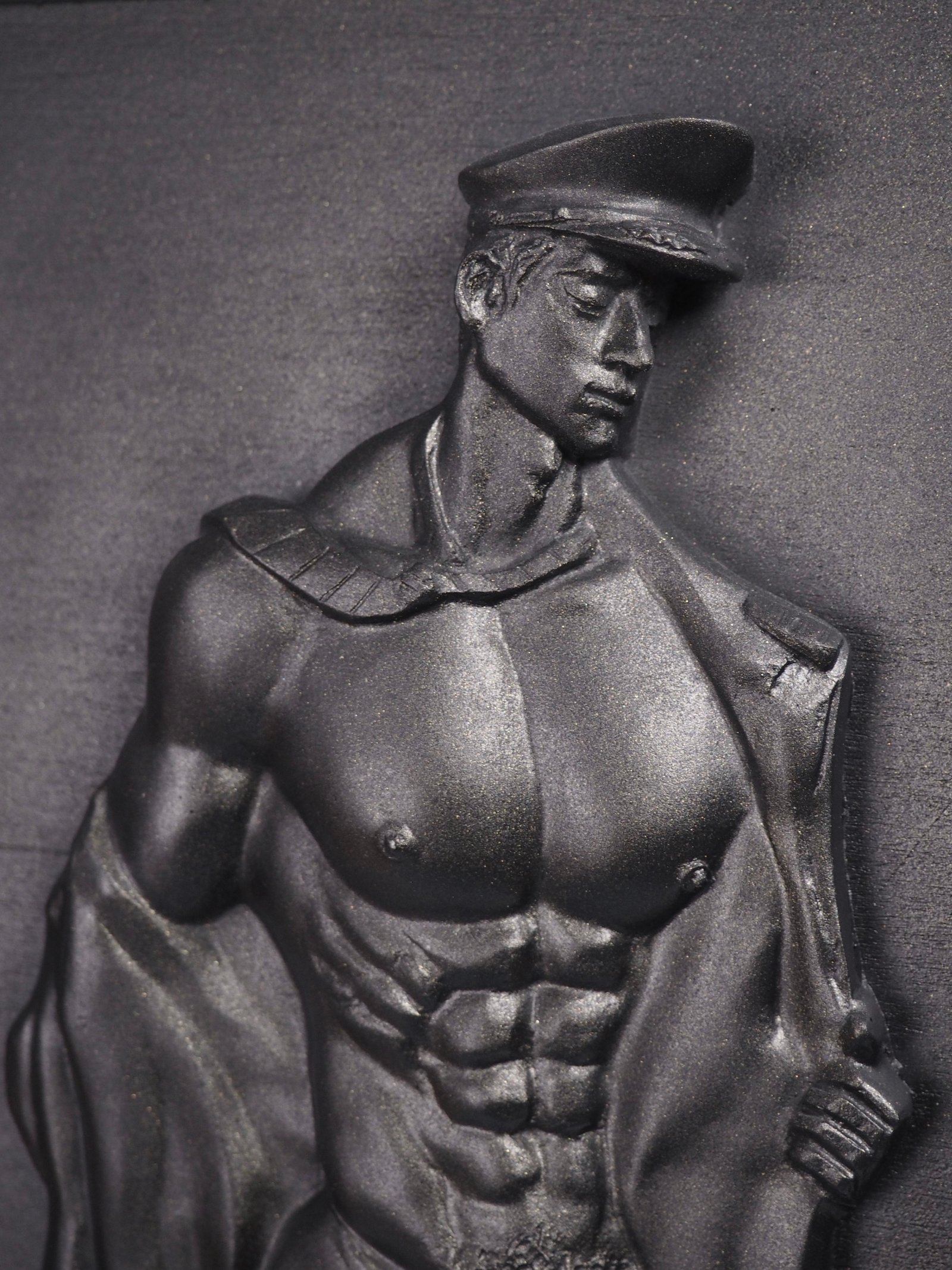 Detail view of Beneath the Rank Black Gold resin sculpture