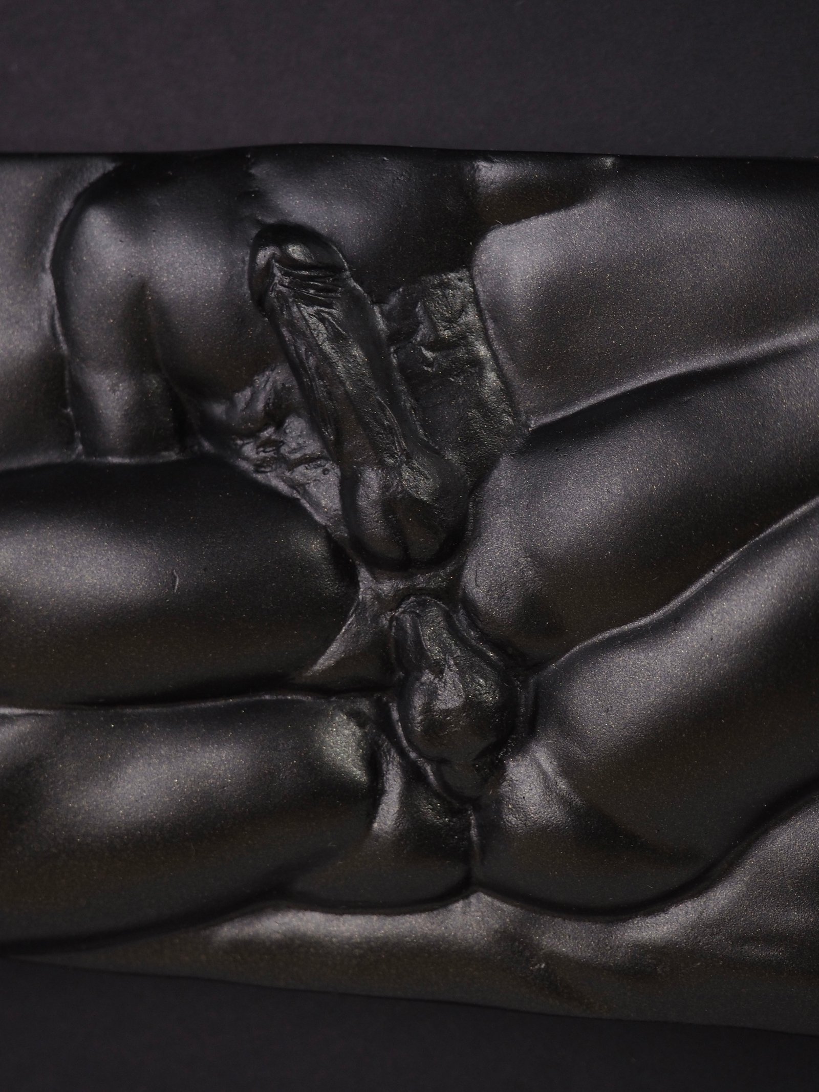 Detail view of Eros resin sculpture