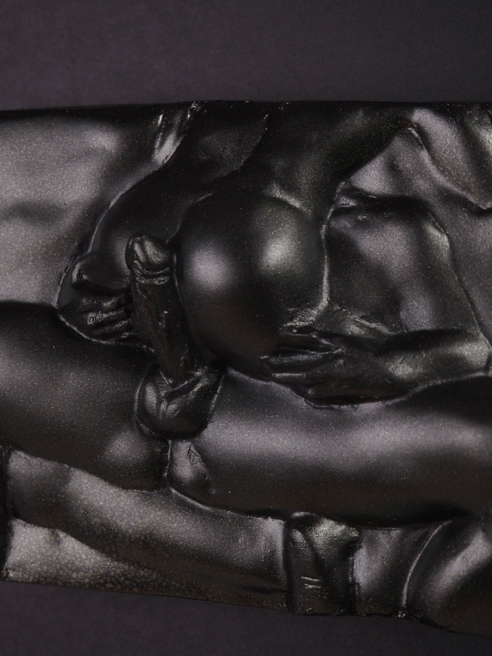 Detail view of Eros resin sculpture