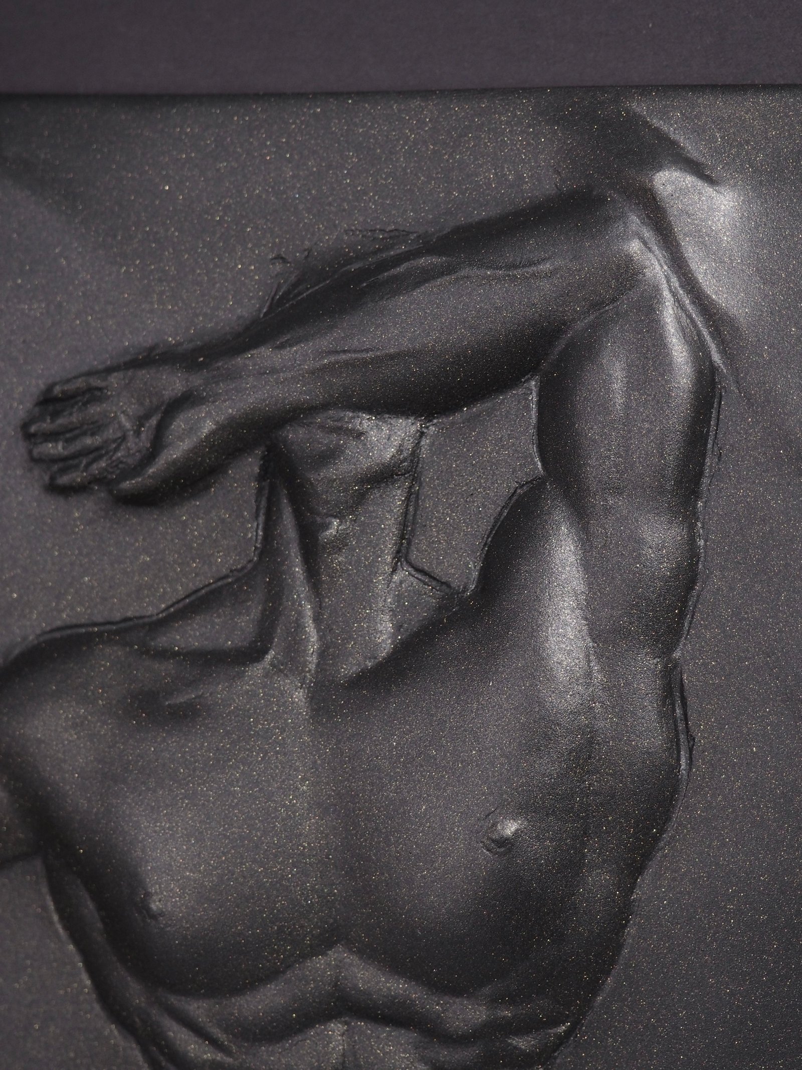 Detail view of Overcome Black Gold resin sculpture