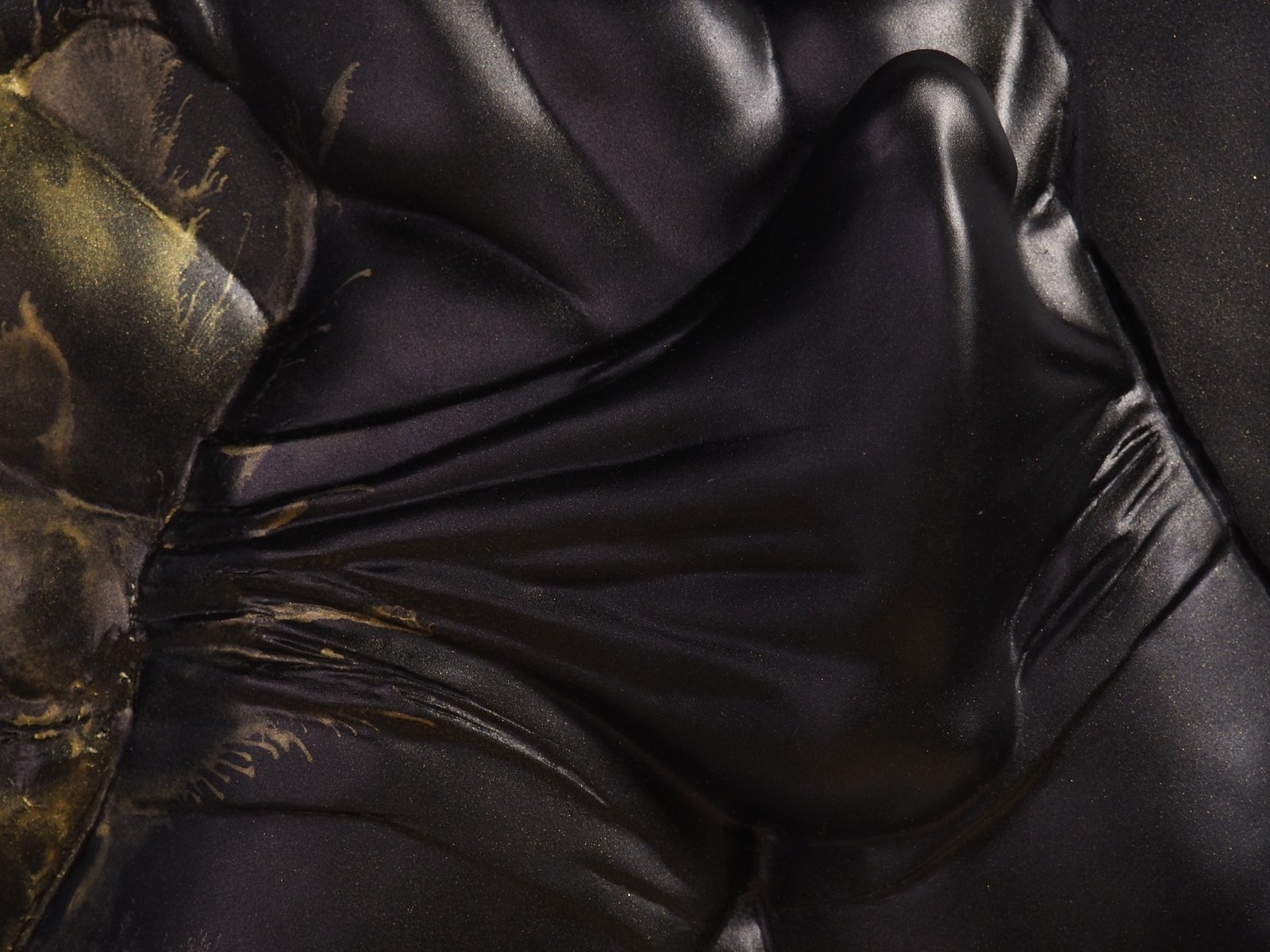 Detail view of The Shape of Want Gold Splash resin sculpture