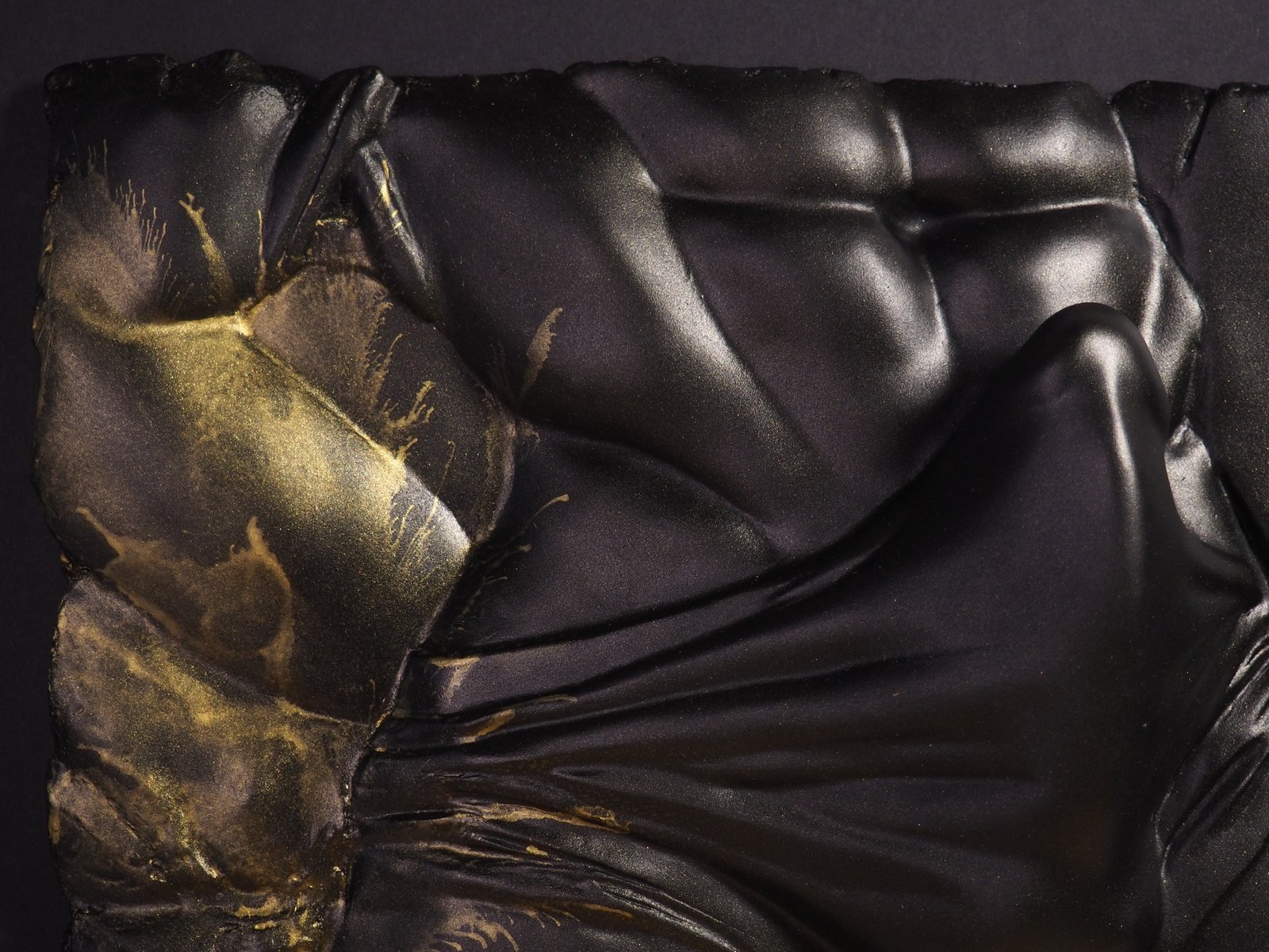 Detail view of The Shape of Want Gold Splash resin sculpture