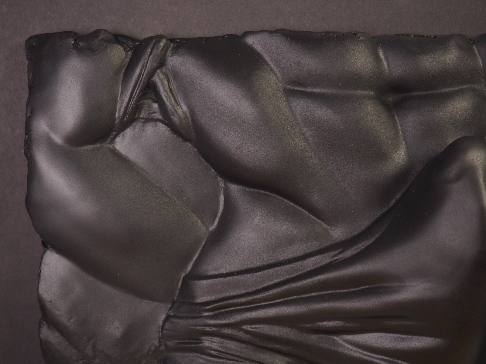 Detail view of The Shape of Want Pure Black resin sculpture