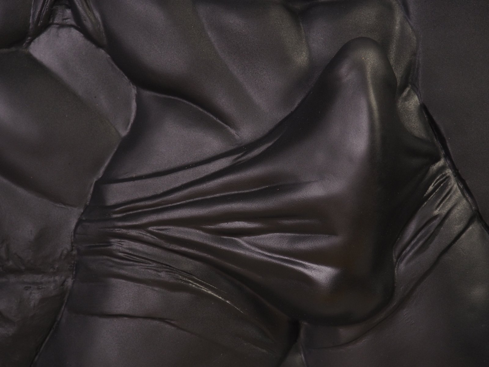 Detail view of The Shape of Want Pure Black resin sculpture