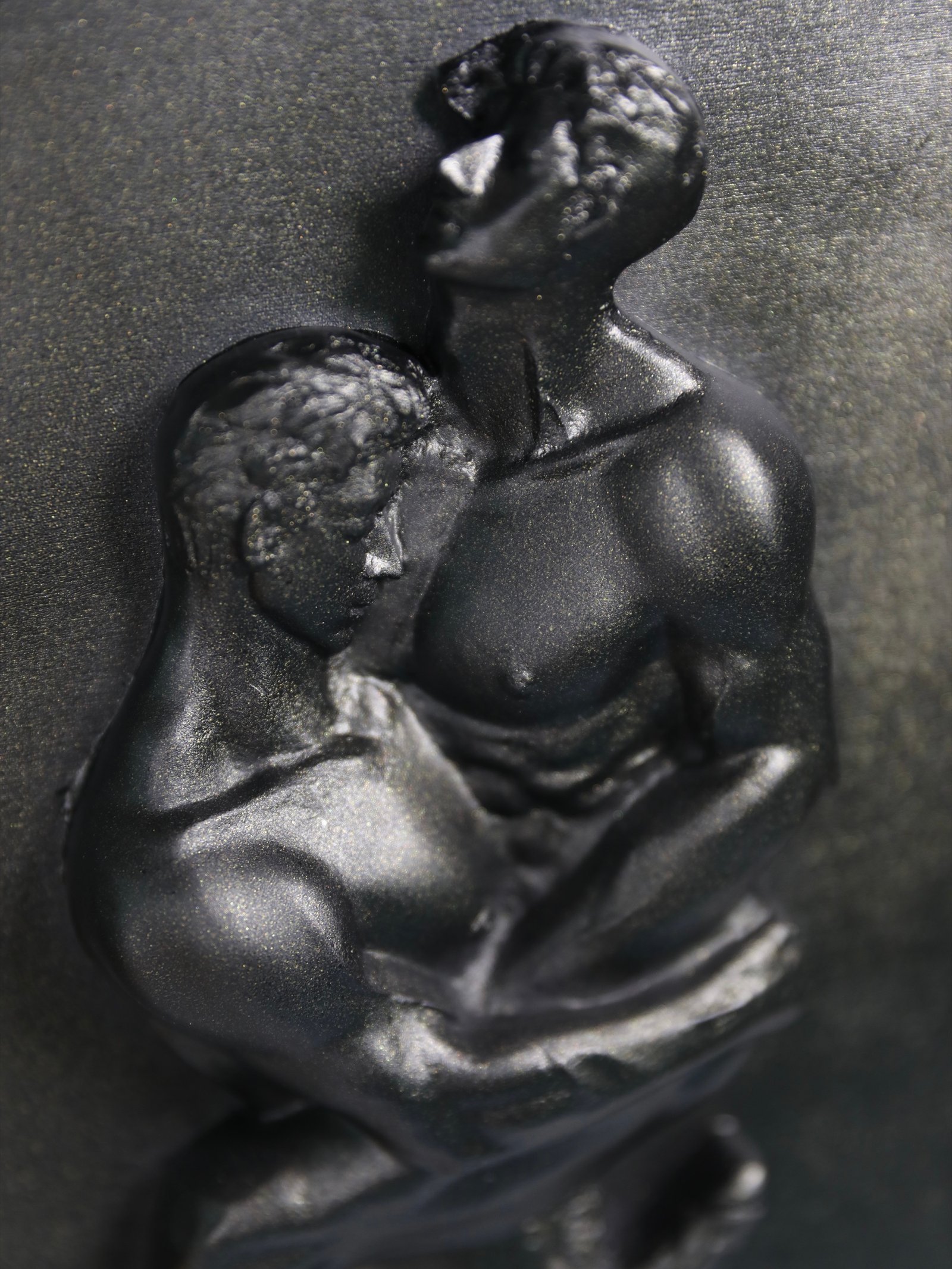 Detail view of Where We Yield Black Gold resin sculpture